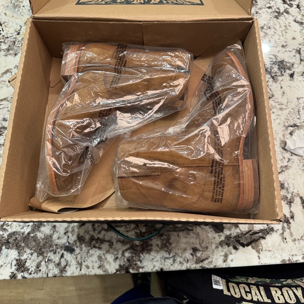 Still new smell. Worn one time. Comfort and ease of zip.